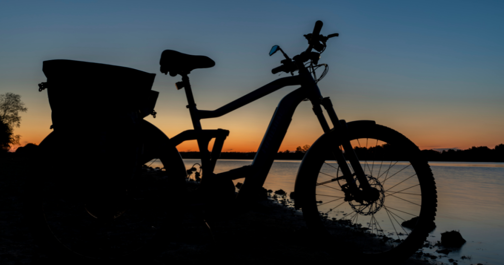e-bike near water at sunset