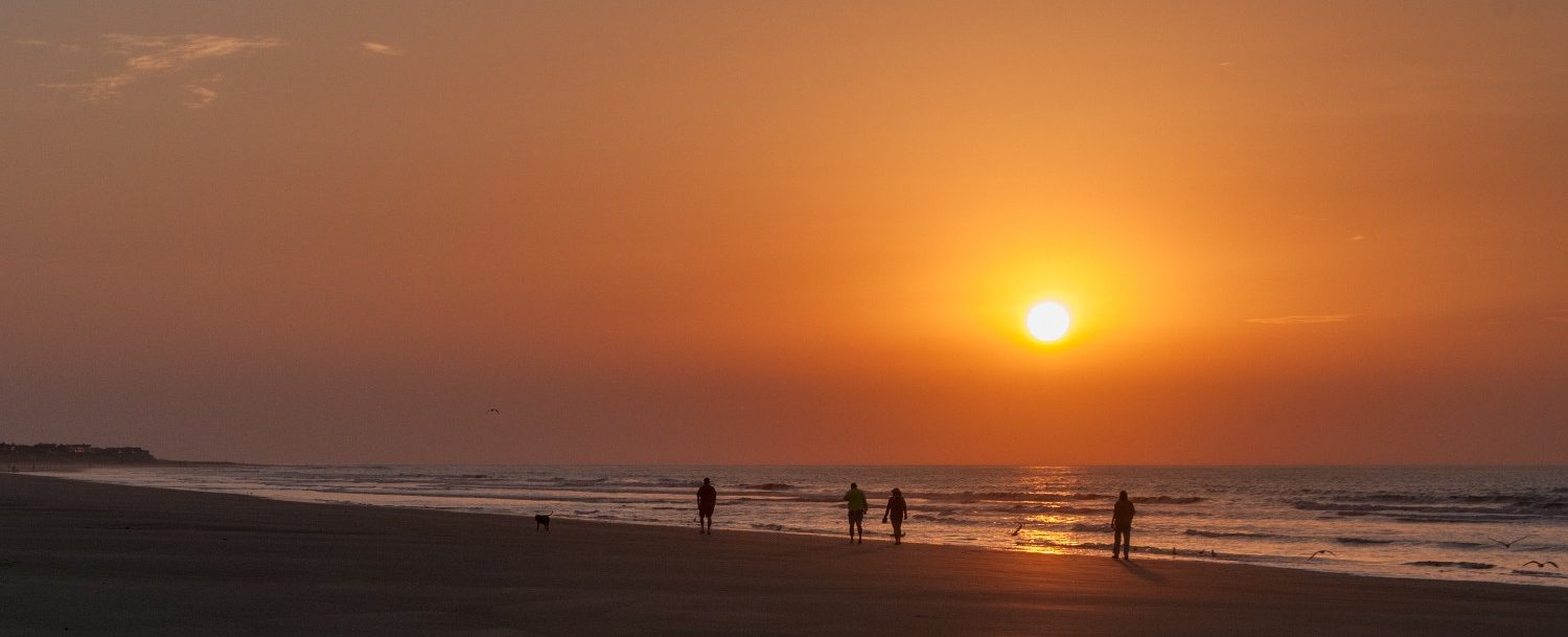 People walking on beach at Isle of Palms, South Carolina.