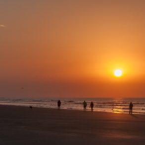 People walking on beach at Isle of Palms, South Carolina.