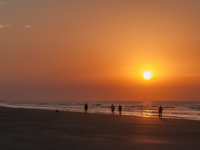 People walking on beach at Isle of Palms, South Carolina.