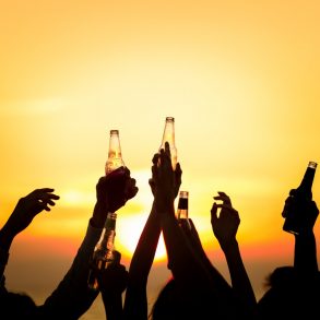 people at sunset drinking at the windjammer