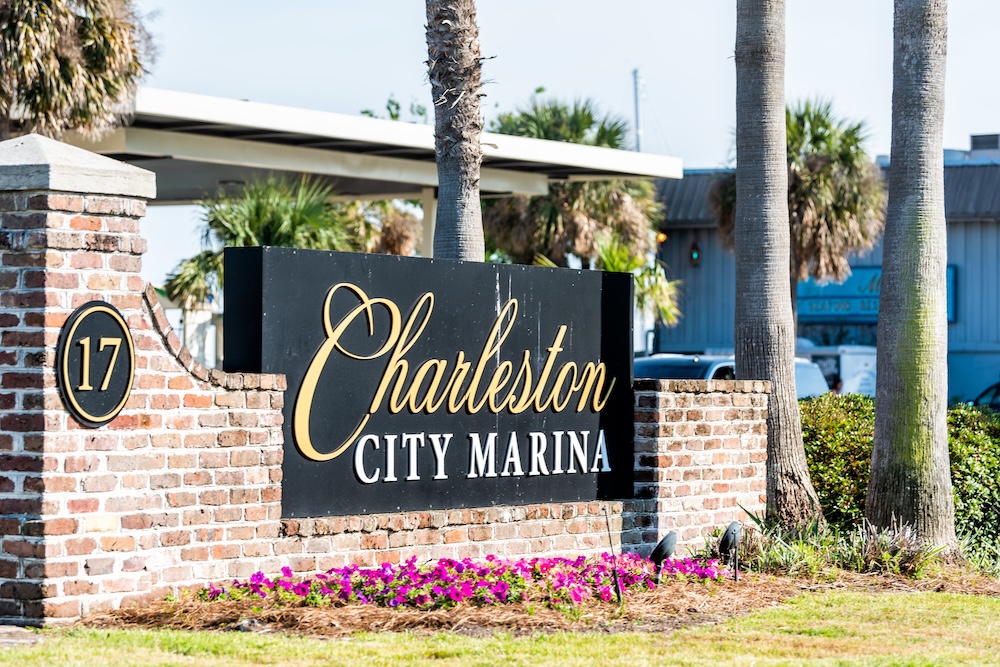 Charleston City Marina sign on street in South Carolina for boating during summer day.