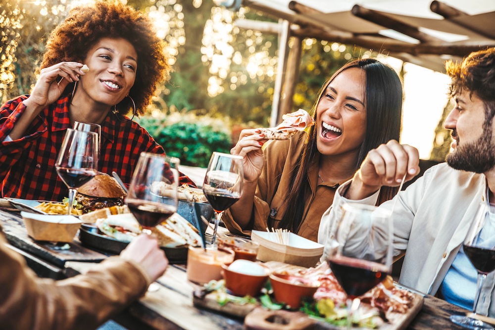 A group of friends eating dinner together. 