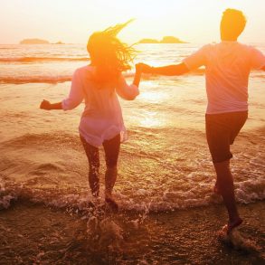silhouette of couple on the beach at sunset