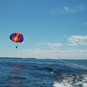 Person parasailing above the ocean.