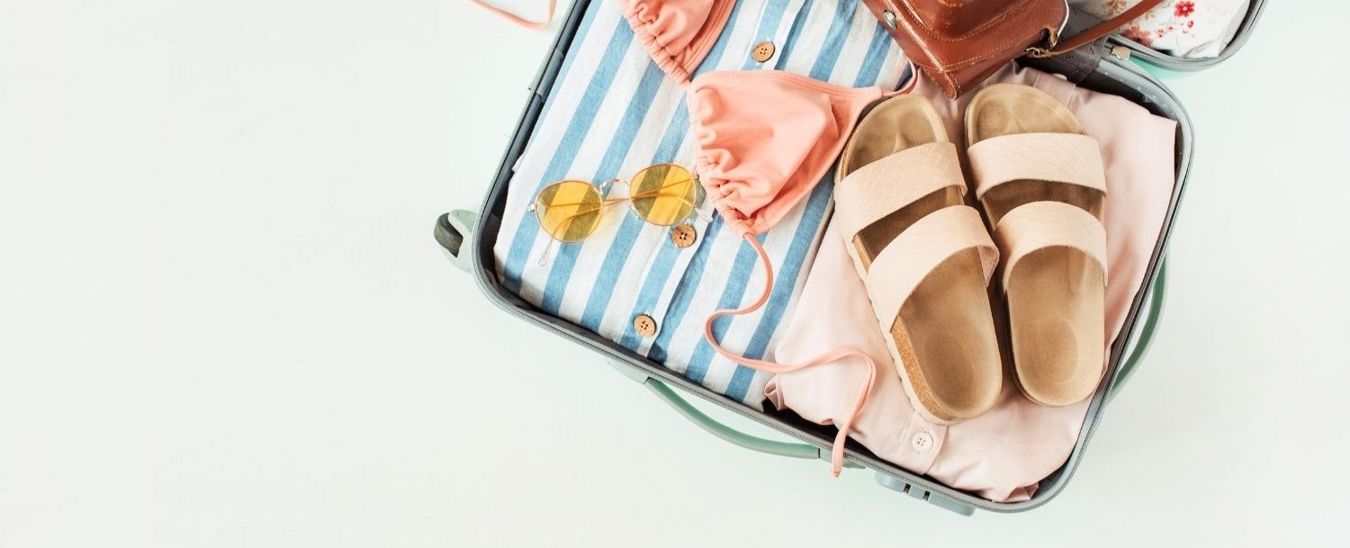 Suitcase with beach necessities