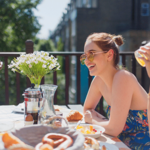 Friends smiling and enjoying brunch