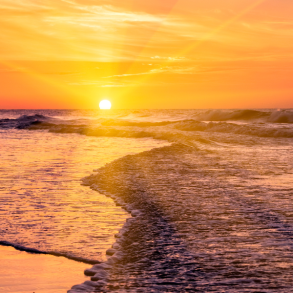 woman on beach at sunrise