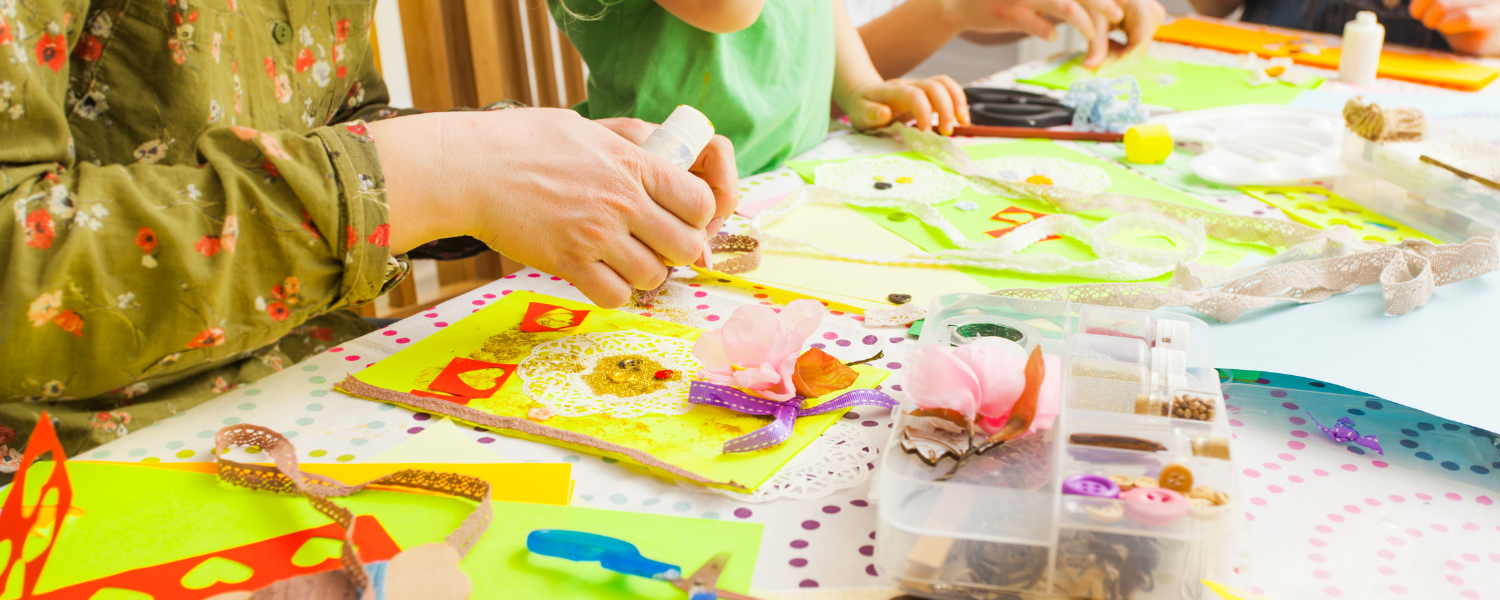 children at art table making art projects