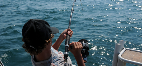 man in hat fishing