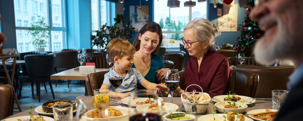 multigenerational family eating at restaurant