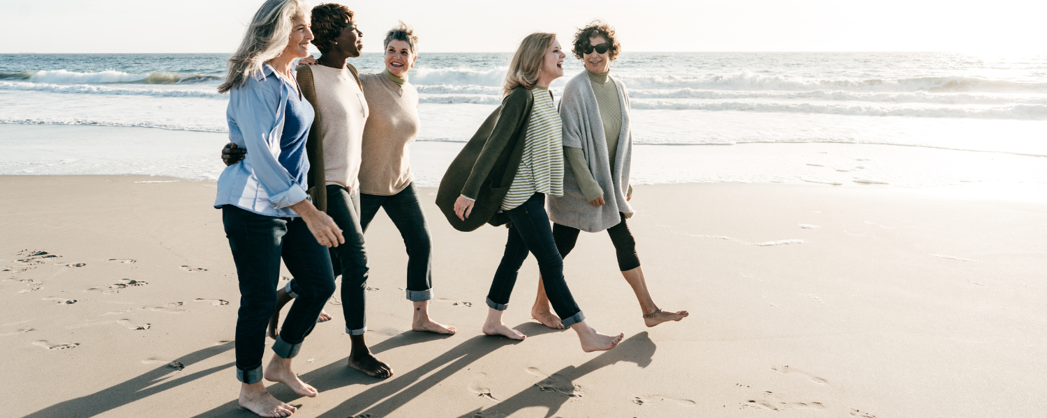 group of women walking on beach