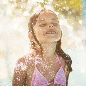young girl playing in water