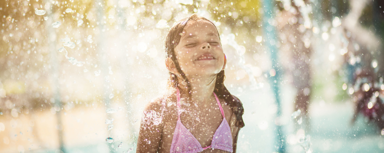 young girl playing in water