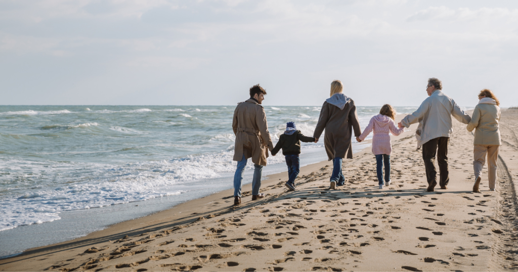 family walking on beach